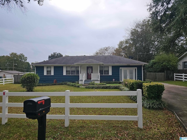 ranch-style home with a front lawn