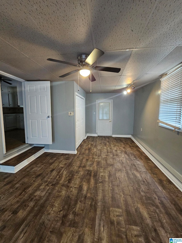 spare room featuring ceiling fan and dark hardwood / wood-style flooring