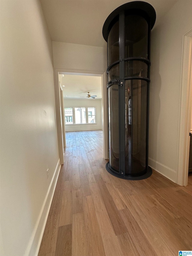 corridor featuring light hardwood / wood-style floors