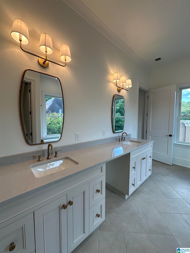 bathroom featuring tile patterned flooring and vanity