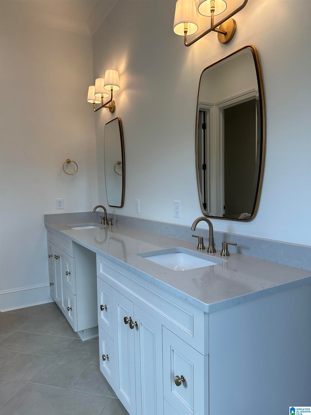 bathroom featuring tile patterned flooring and vanity