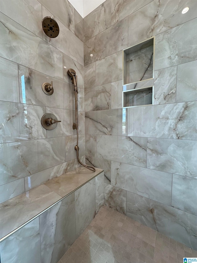 bathroom featuring tiled shower