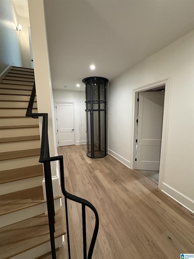 1227 23rd St S Unit B2, Birmingham, AL 35205 - staircase featuring wood finished floors, baseboards, and recessed lighting