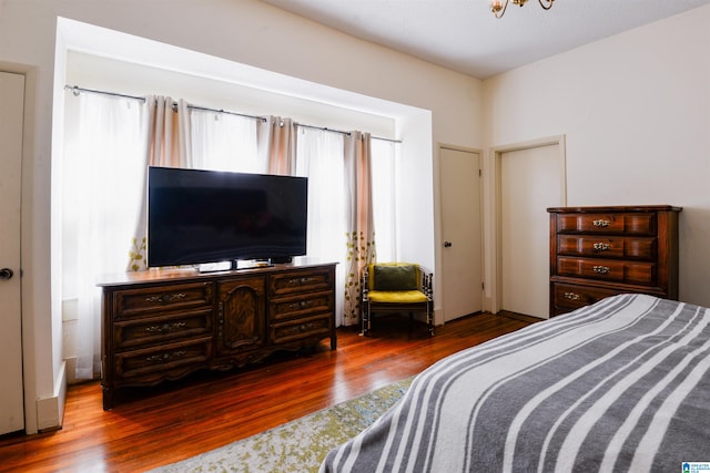 bedroom with hardwood / wood-style flooring