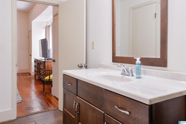 bathroom featuring vanity and hardwood / wood-style floors