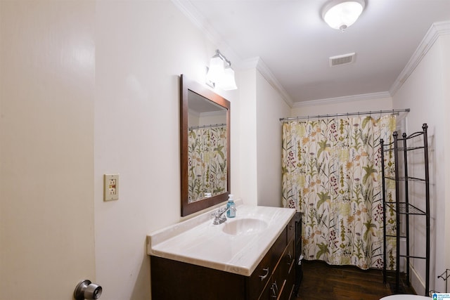 bathroom featuring vanity, hardwood / wood-style floors, a shower with curtain, and crown molding