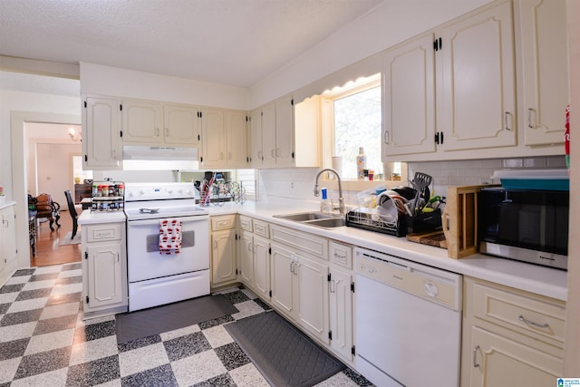 kitchen with white cabinets, white appliances, tasteful backsplash, and sink