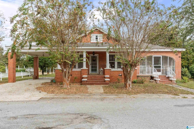 view of front of property with a carport