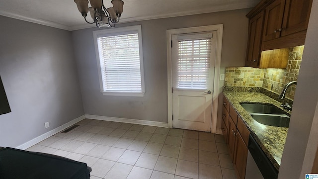 kitchen featuring dishwasher, sink, crown molding, stone countertops, and decorative backsplash