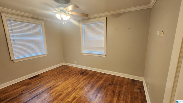 empty room featuring hardwood / wood-style flooring, ceiling fan, and crown molding