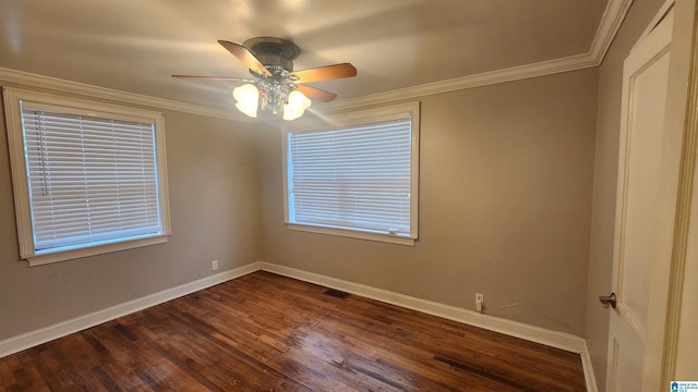 spare room featuring ceiling fan, dark wood-type flooring, and ornamental molding