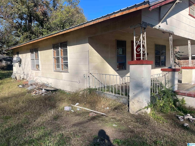 view of home's exterior with covered porch