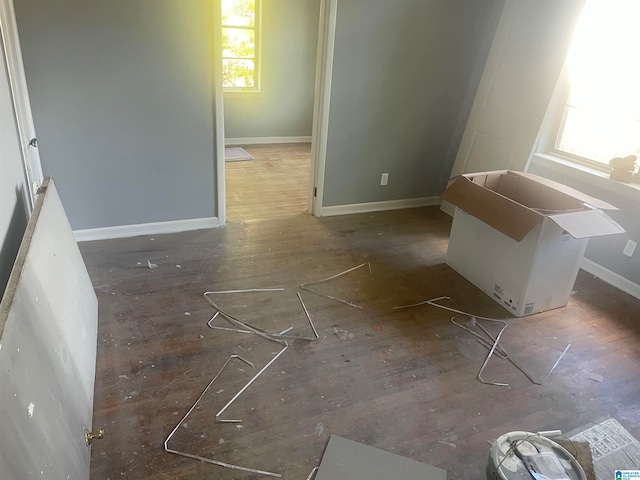 empty room featuring dark wood-type flooring