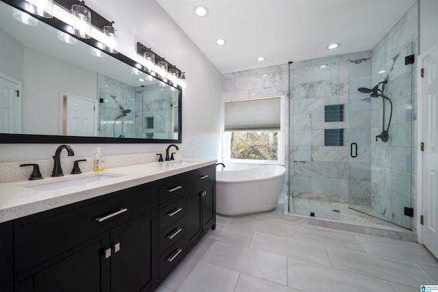 bathroom with plus walk in shower, vanity, and tile patterned flooring