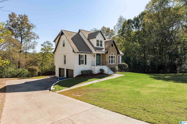 view of front of house featuring a front yard and a garage