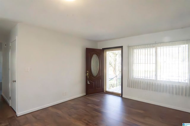 entryway with dark hardwood / wood-style floors