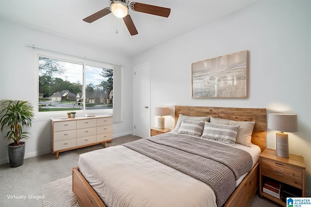 carpeted bedroom with ceiling fan