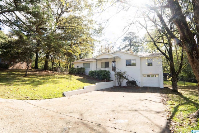 single story home with a front yard and a garage