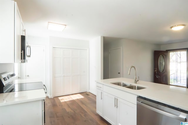 kitchen with white cabinetry, dishwasher, sink, dark hardwood / wood-style floors, and range