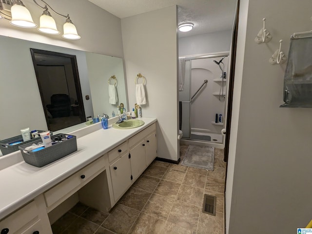 904 Marble Quarry Rd, Talladega, AL 35160 - full bath with a shower stall, vanity, toilet, and stone finish floors