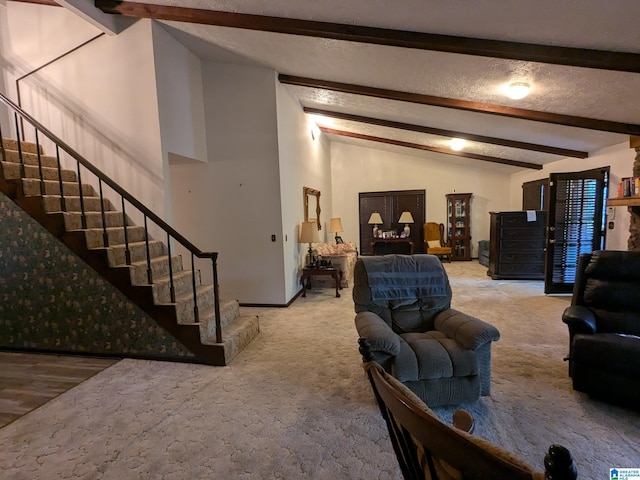 living room with lofted ceiling with beams and carpet flooring