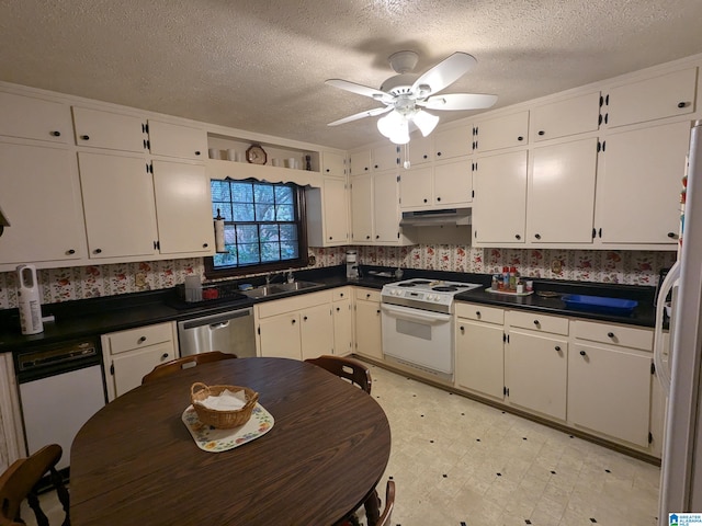 kitchen with ceiling fan, white cabinetry, sink, and white appliances