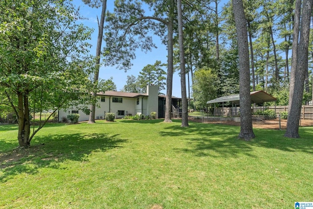 view of yard with a carport