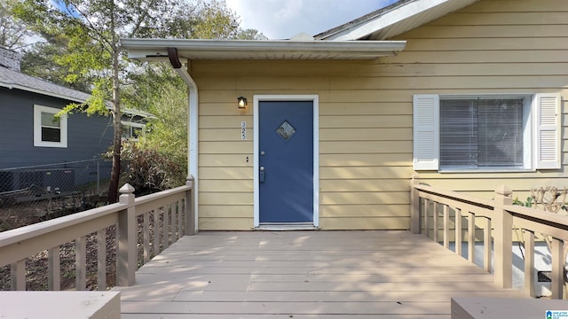 entrance to property with a deck