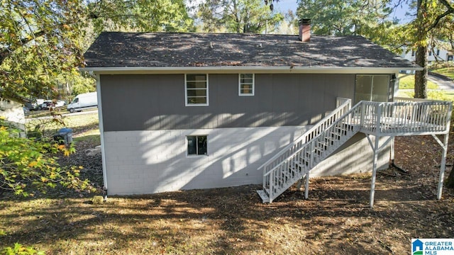 view of home's exterior with a wooden deck