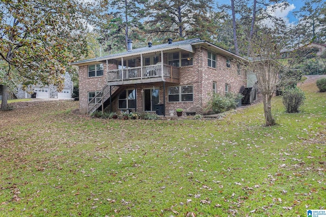 rear view of house featuring a lawn