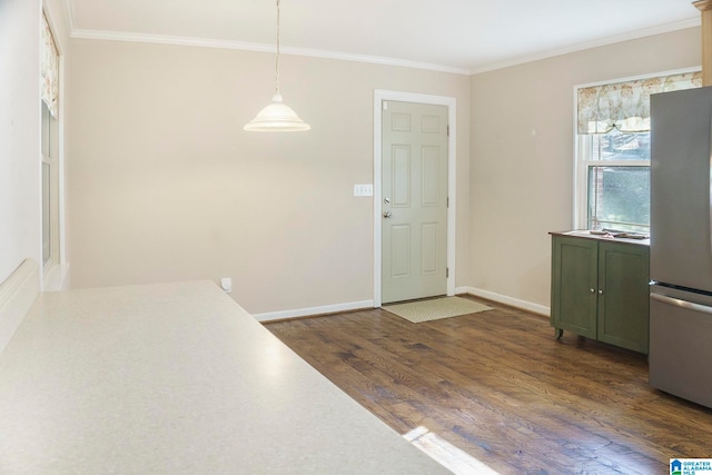 entryway featuring ornamental molding and dark wood-type flooring