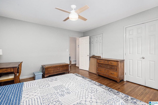 bedroom with ceiling fan and dark hardwood / wood-style flooring