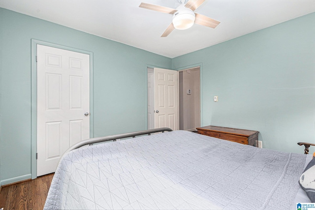 bedroom with ceiling fan and hardwood / wood-style floors