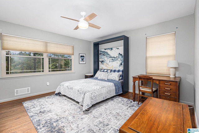 bedroom featuring wood-type flooring and ceiling fan