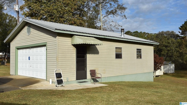 garage with a yard