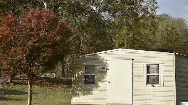 view of outdoor structure with a lawn