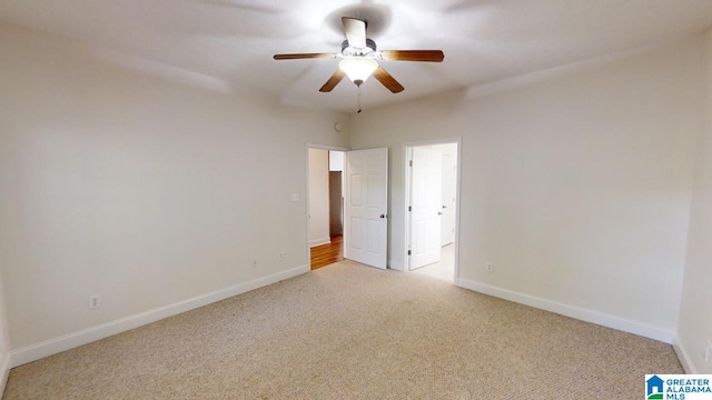 carpeted empty room with ceiling fan