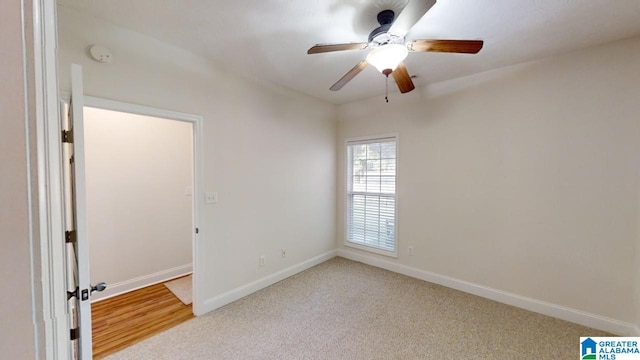 unfurnished room featuring light carpet and ceiling fan