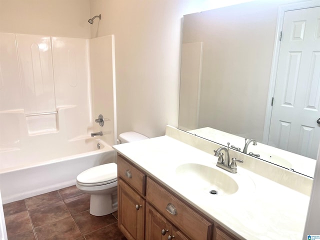 full bathroom featuring tile patterned floors, vanity, toilet, and tub / shower combination