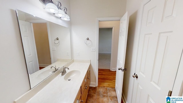 bathroom featuring tile patterned flooring and vanity