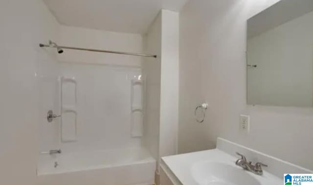 bathroom with vanity and bathing tub / shower combination