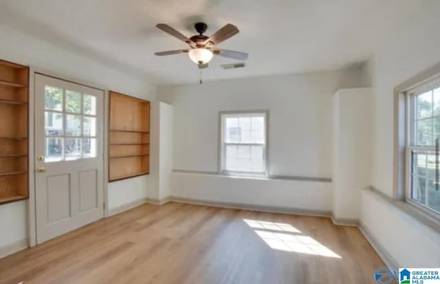 interior space featuring a wealth of natural light and light hardwood / wood-style floors