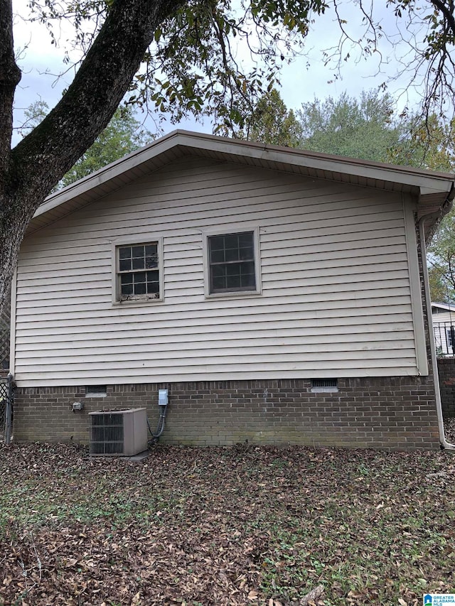 view of home's exterior with cooling unit