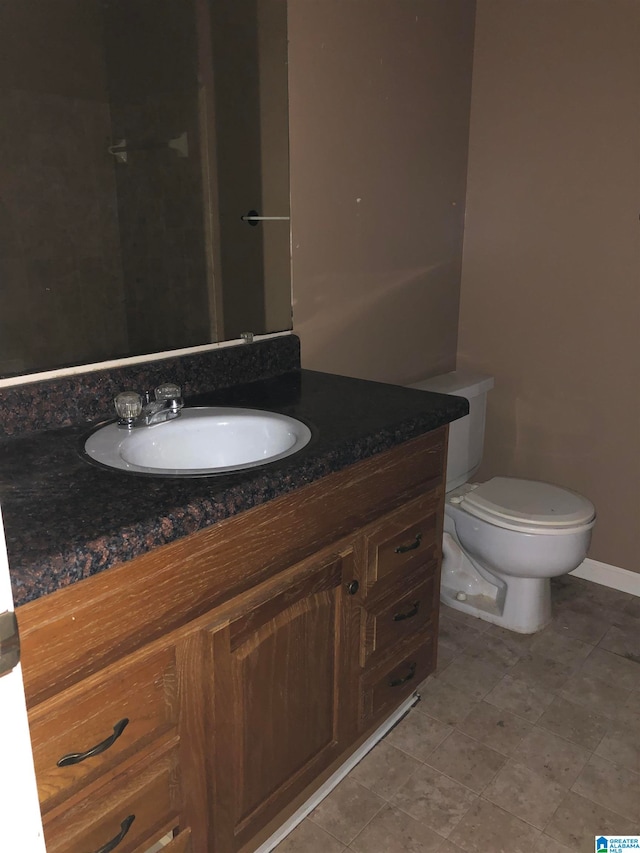 bathroom with vanity and toilet