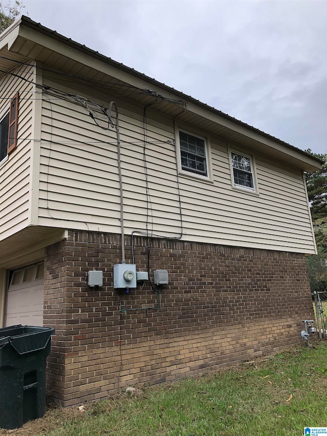 view of side of property featuring a garage