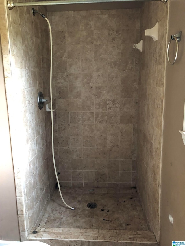 bathroom with tiled shower