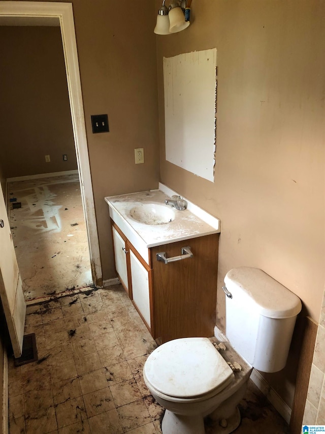 bathroom with vanity and toilet