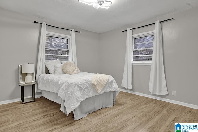 bedroom with light hardwood / wood-style floors