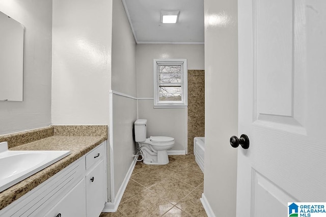 bathroom featuring tile patterned floors, vanity, and toilet