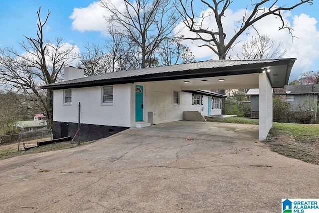 exterior space with a carport